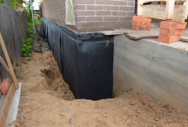 Happy homeowners after waterproofing job in Bowler